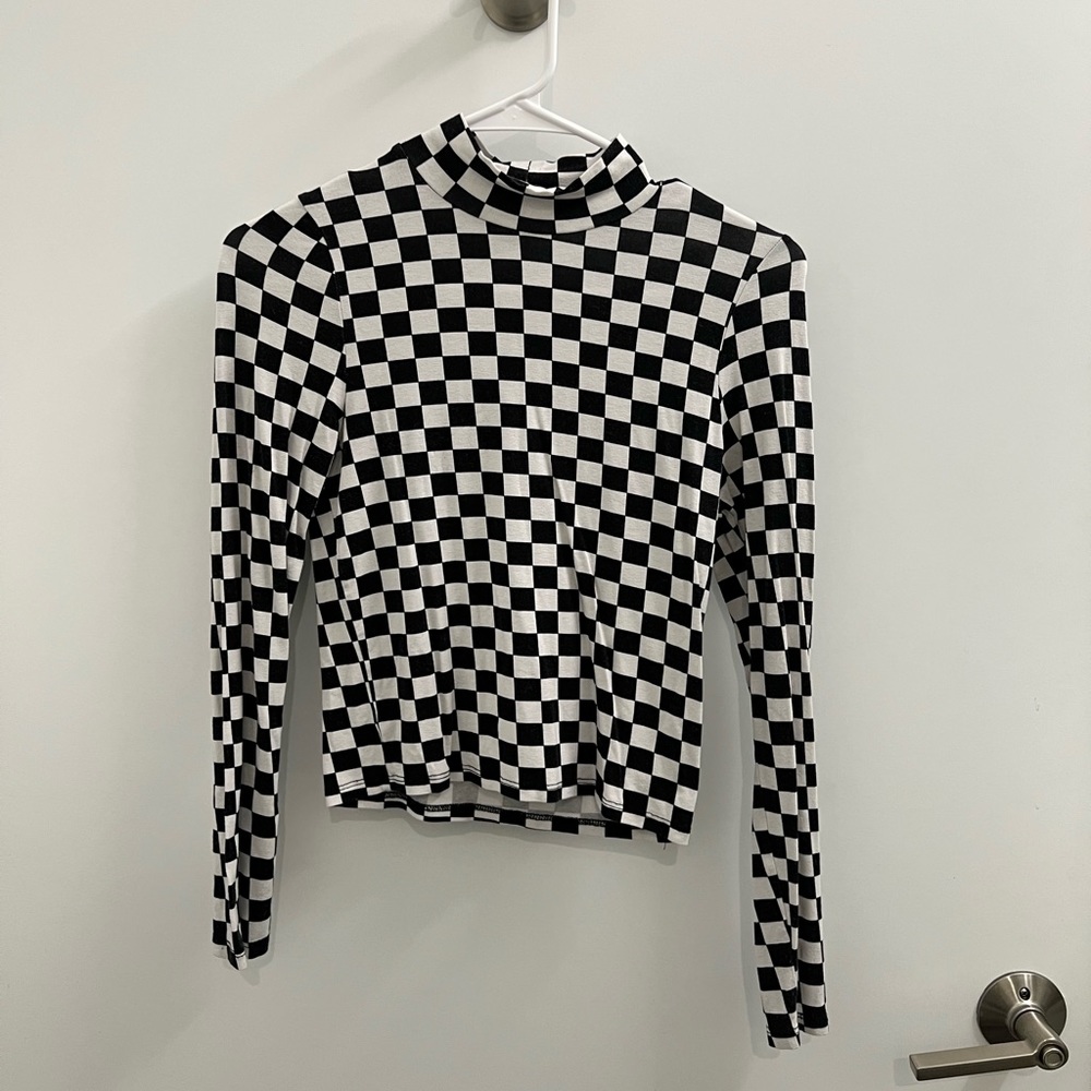 Subdued checkered mock neck top
